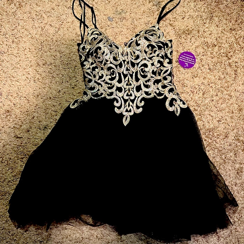 New. Junior size 7. Mini dress